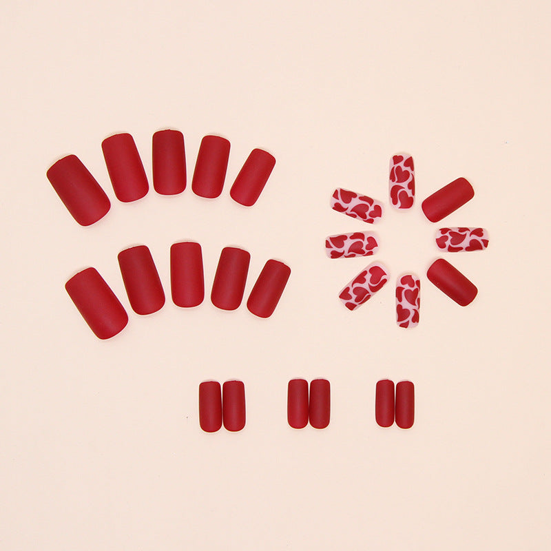 Spicy design medium long matt red color press on nail with heart shape